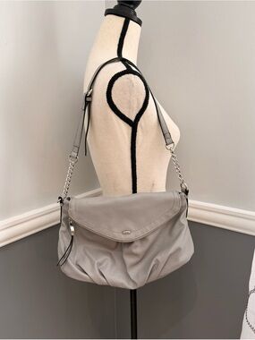 Juicy Couture Greta flap crossbody bag featuring silver chain hardware